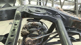Side view of Rust Buster Rear Upper Coil Spring Bucket For FJ Cruiser/ 4Runner RB8426 installed to the frame