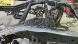 Opposing side view of Rust Buster Rear Upper Coil Spring Bucket For FJ Cruiser/ 4Runner RB8426 installed to the frame