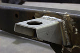 Side view of one Rust Buster Body Mount Bracket For 1997-2006 Jeep Wrangler RB4018 installed to the frame rail