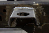 Frontal view of one Rust Buster Body Mount Bracket For 1997-2006 Jeep Wrangler RB4018 installed to the frame rail