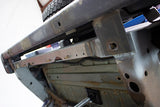 Side view of Rust Buster Rear Crossmember For 1997-2006 Jeep Wrangler RB4022 installed to the frame rail