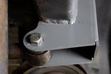 Side view of Rust Buster Track Bar Bracket For 1997-2006 Jeep Wrangler RB4023 installed to the frame rail