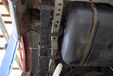 View looking up at one Rust Buster Center Unibody Stiffener For 1984-2001 Jeep Cherokee RB6061, installed to the frame rail